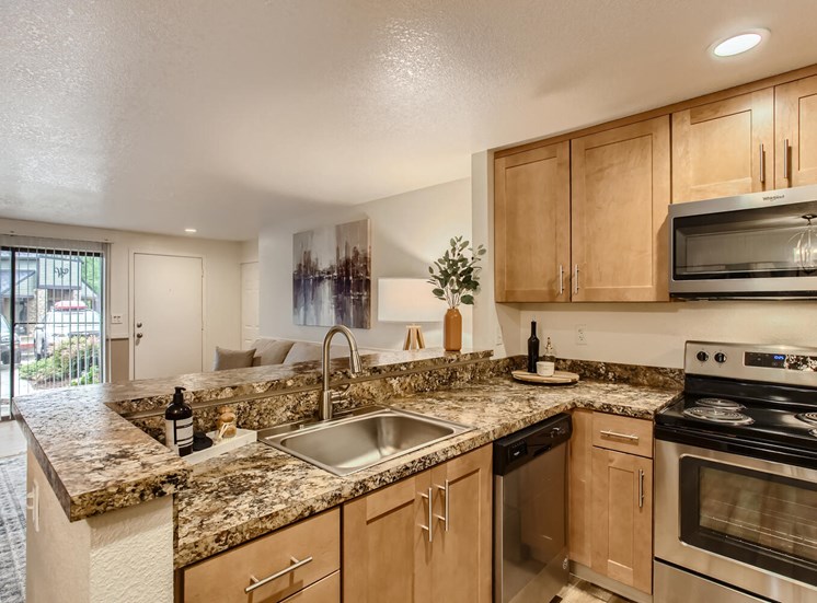 Lake Oswego Apartments for Rent - Westlake Meadows - Kitchen with Spacious Countertops, Stainless-Steel Appliances, and Wooden Cabinets